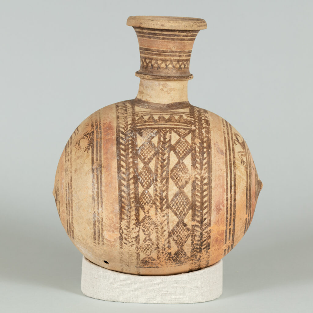 Alternate view of Barrel jug with single handle, painted with various patterns wrapped around its base.
