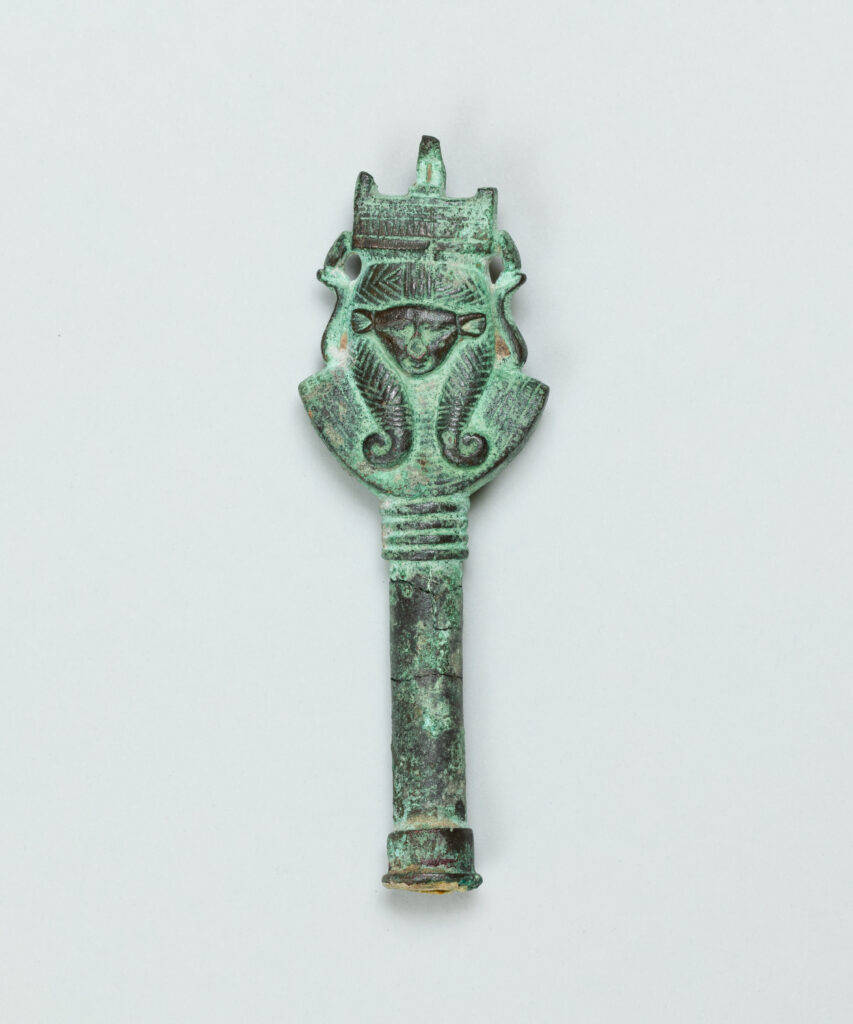 Green-tinted carved handle with a goddess head.