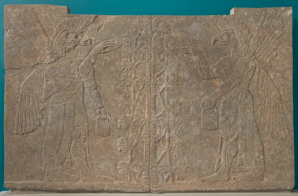 Relief panel carved with a winged, eagle-headed spirit on each side mirroring each other.