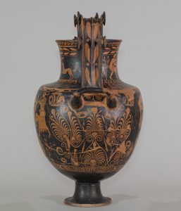 Alternate view of An ancient, ornately-decorated, two-handled, greek vase. The black background is decorated wth assorted brownish-orange floral motifs, male youths,satyrs and a winged figure on the base and neck.
