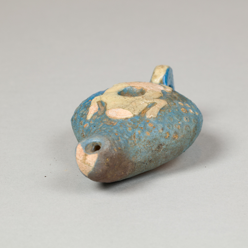 Alternate view of Sky blue, gravy boat-shaped vessel with a white frog carved into the top.