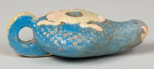 Alternate view of Sky blue, gravy boat-shaped vessel with a white frog carved into the top.