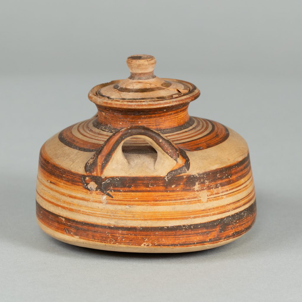 Alternate view of Low vessel with lid and two handles, painted with red and black stripes of varying widths.