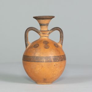 Alternate view of Orange flask with two handles, painted with black stripes and circles.