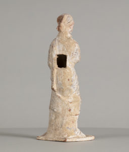 Alternate view of White terracotta statue of a woman wearing a head wrap and a toga, holding a chaplet.