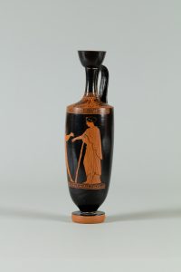 Alternate view of Tall, black terracotta flask with a red figure and scroll trim.