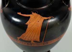 Alternate view of Black terracotta vessel with two handles and red-figure painting depicting a youth playing a flute while another figure observes.