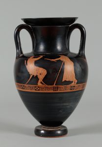 Black terracotta vessel with two handles and red-figure painting depicting a youth playing a flute while another figure observes.