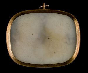 Alternate view of White chalcedony cameo depicting a man a woman, set into an oval pendant.