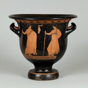 Black terracotta vase with two handles and red-figure painting depicting two figures and a scroll pattern.