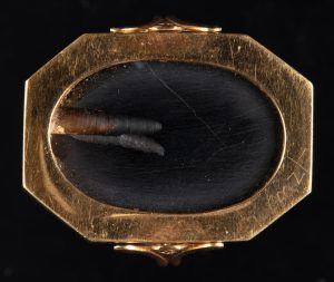 Alternate view of Gold-framed onyx cameo depicting a person riding a two-horse chariot.