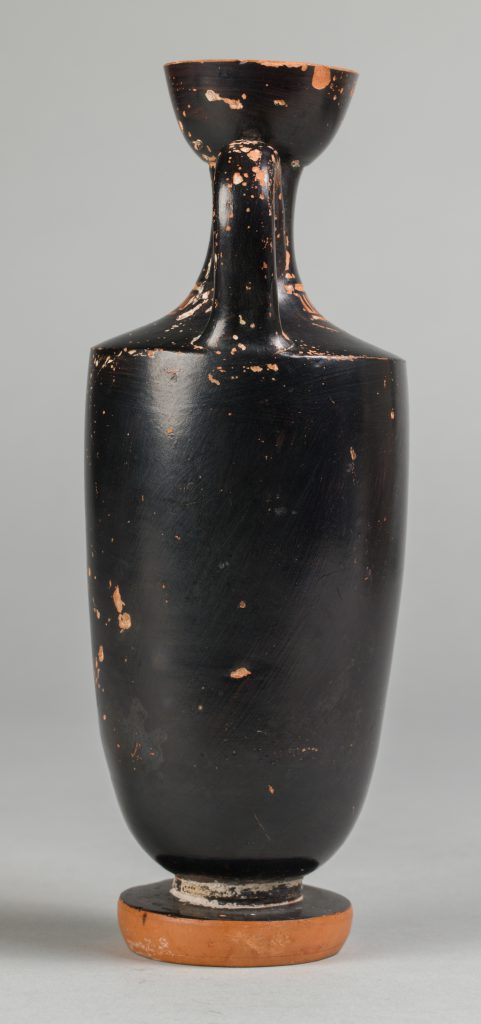 Alternate view of Terracotta flask with one handle, painted with red figure playing a flute.