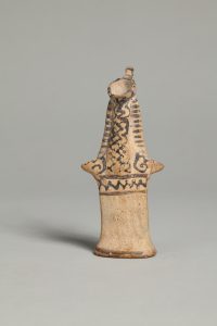 Alternate view of Orange terracotta statue of figure with bird-like head, trimmed with black painted patterns.