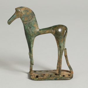 Alternate view of Bronze figurine of a horse mounted on a small base, its back leg broken in one spot.
