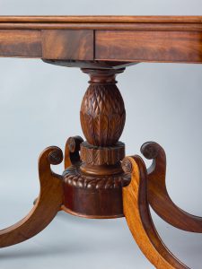 Alternate view of Mahogany card table with an ornatiely carved base.