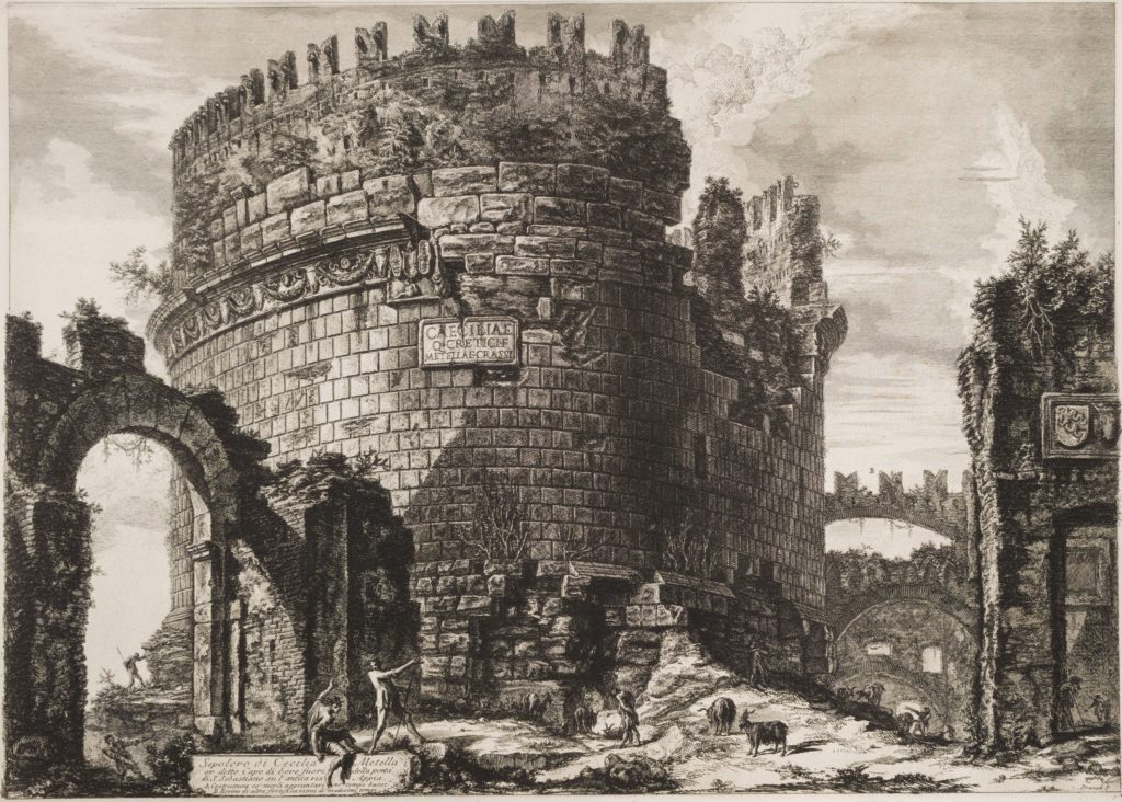 Engraving of the large, cylindrical ruin of a tomb overgrown with plantlife. Small figures and goats stand at its base.