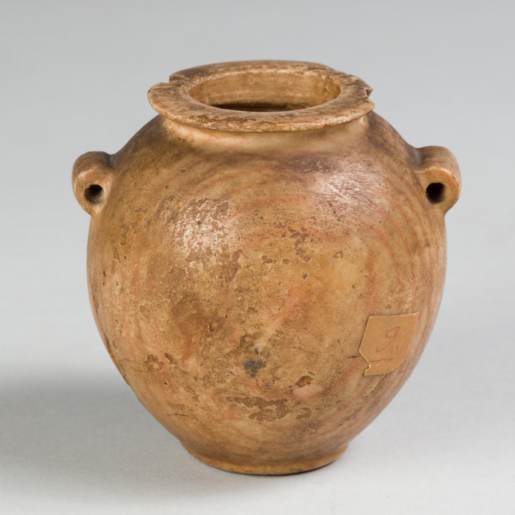 Alternate view of Orange-tinted jar with lug handles and subtle rings visible across its cracked surface.