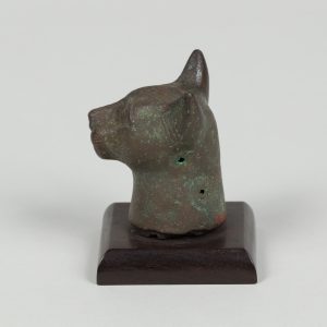 Alternate view of Bronze sculpture of a cat head mounted on a wooden base.