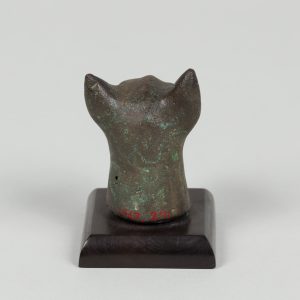 Alternate view of Bronze sculpture of a cat head mounted on a wooden base.